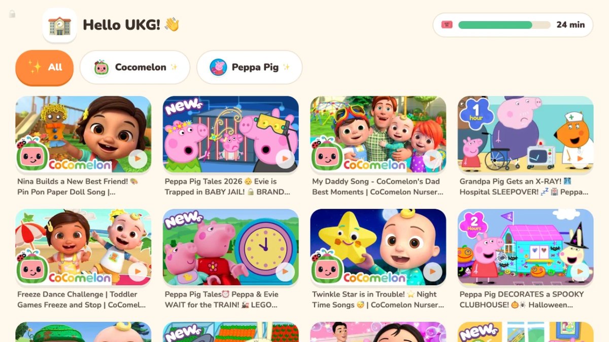A class's screen on the classroom TV: Hello UKG! with big picture tiles of Cocomelon and Peppa Pig videos.